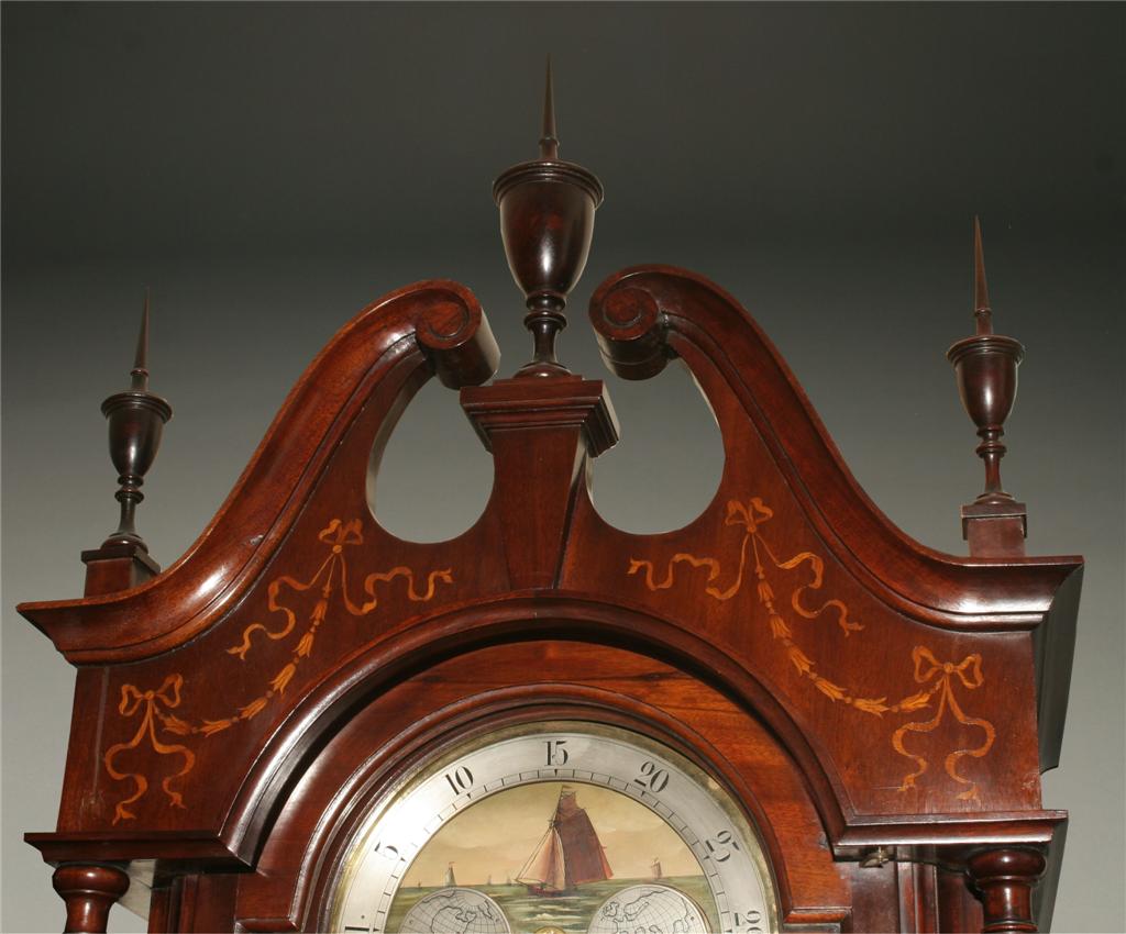 English Elliott clock in inlaid mahogany case
