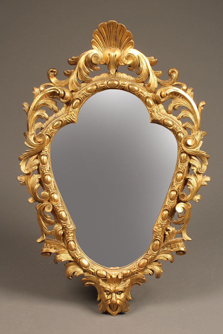 Antique pair of Italian mirrors with gold gilded finish.