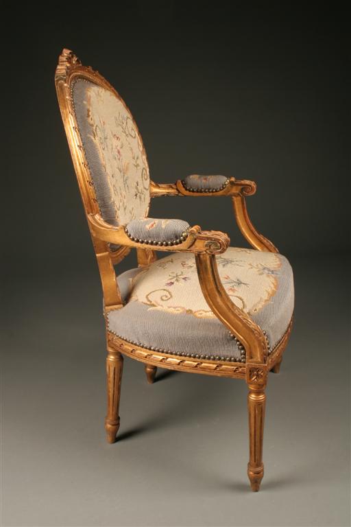 Pair of Louis XVI gilded French armchairs with needlepoint