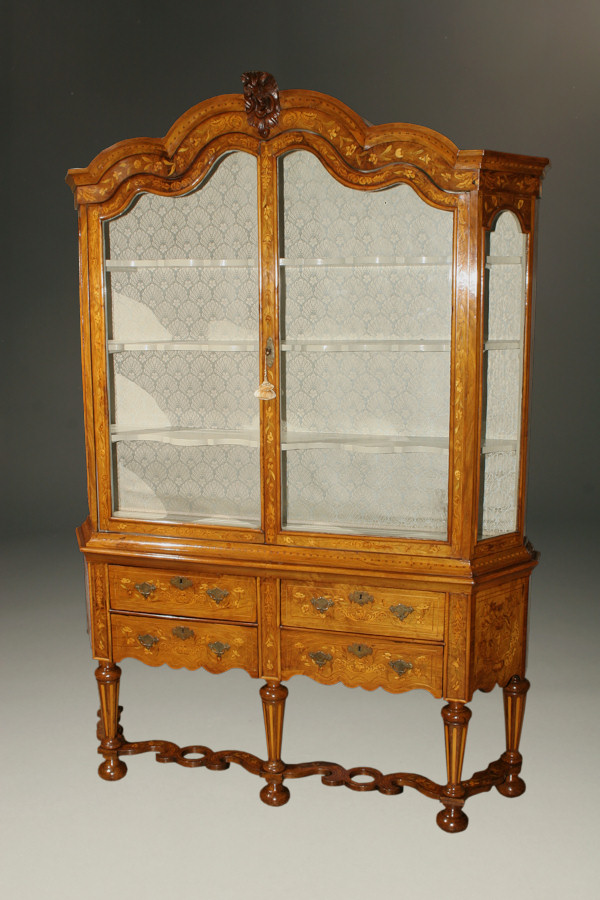 Rare Early 19th Century Dutch Marquetry Inlaid Vitrine The upper cabinet has glass on four sides and includes a fabric backing. The ornamented center piece is typical of Dutch style.