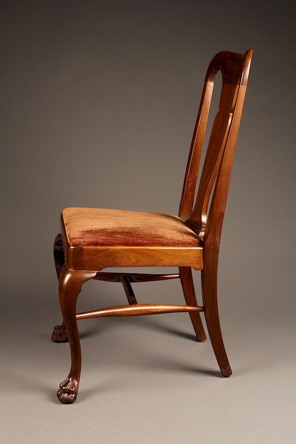 Set of 8 antique mahogany chairs with claw feet.