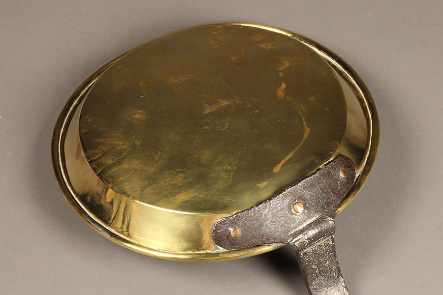 Antique French omelet pan in brass.