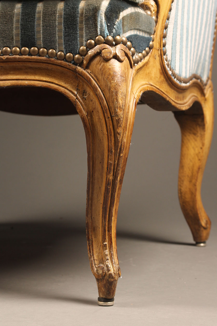 pair of french louis xv style bergére chairs with hand carved frame