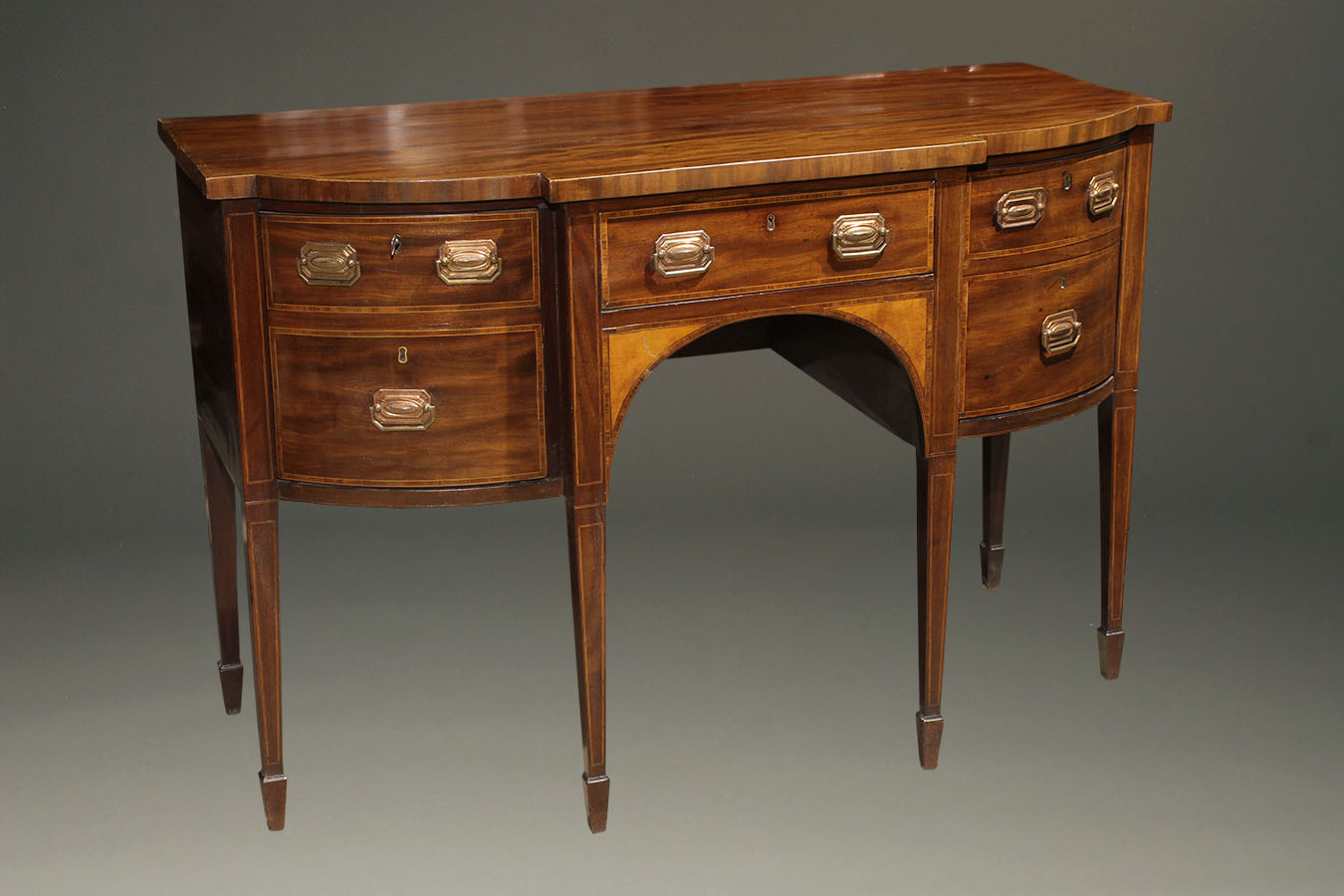 Antique Federal style English sideboard in mahogany.