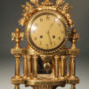Vintage French Louis XVI style clock with gilded finish.