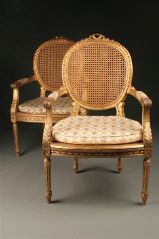 Pair of Louis XVI gilded armchairs with cane seat and back