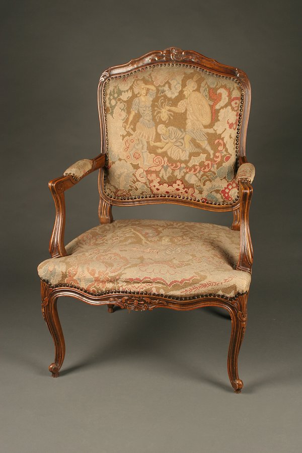 Louis XV style arm chair with needlepoint upholstery.