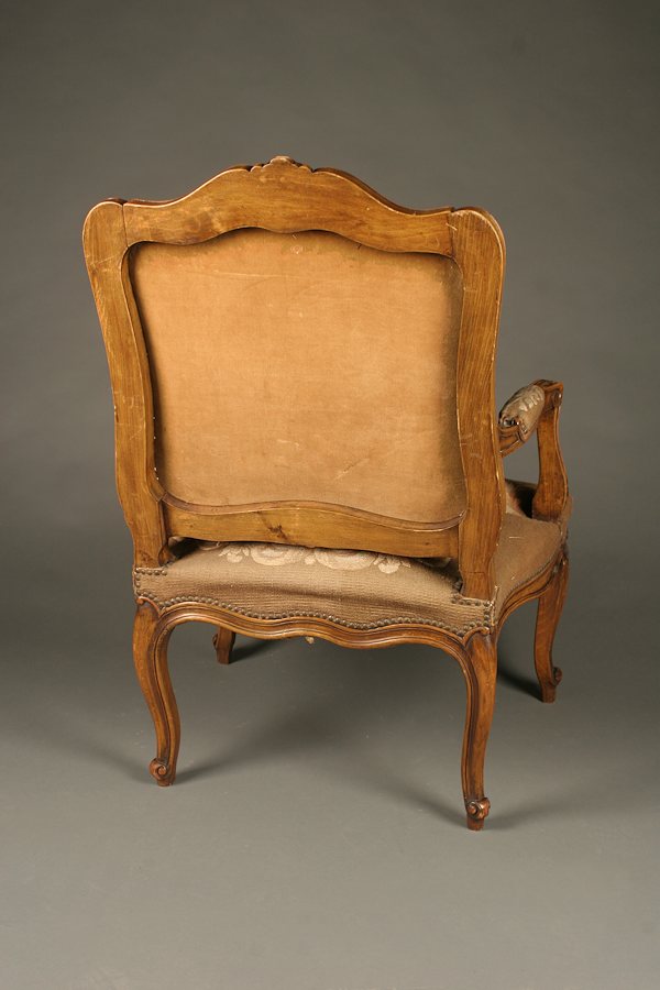 French 19th century Louis XV arm chair with blue upholstery.