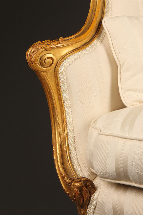 19th century French Louis XV style gilded wing chair.