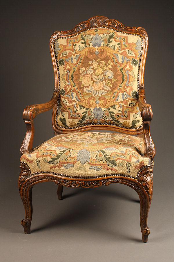 Louis XV style arm chair with needlepoint upholstery.