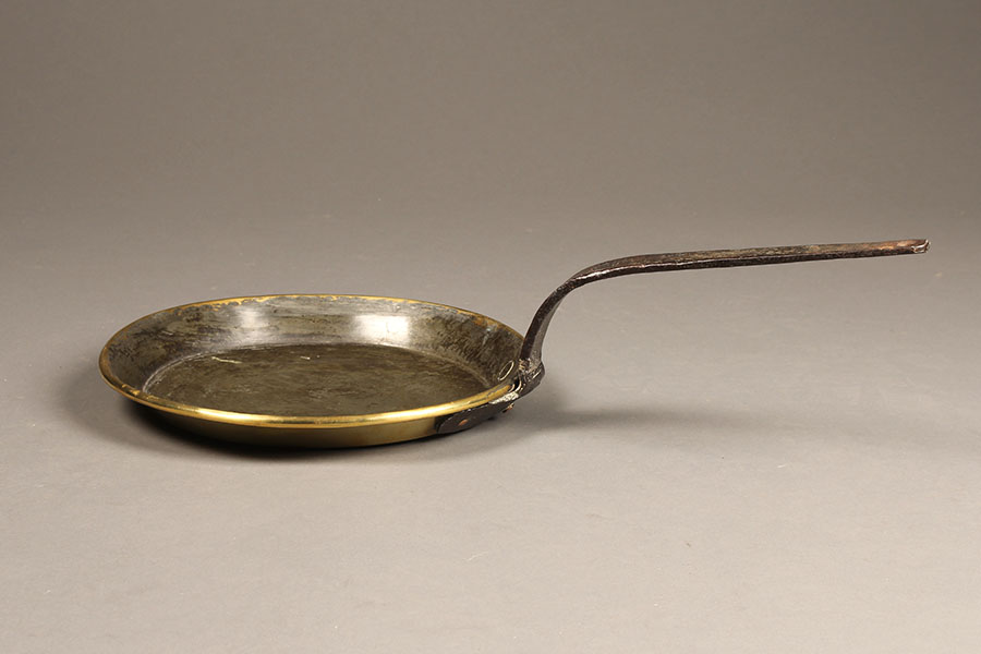 Antique French omelet pan in brass.