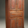 Early 19th century Norwegian pine corner cupboard with original painted finish dated 1825.