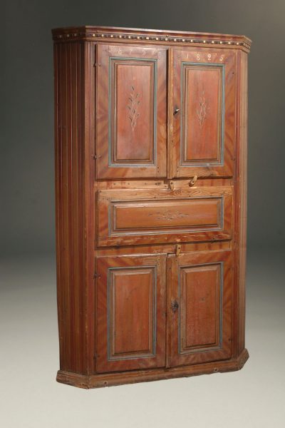 Early 19th century Norwegian pine corner cupboard with original painted finish dated 1825.