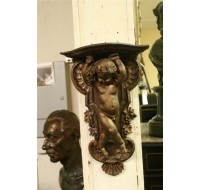 Carved wooden cherub shelf