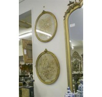 Two oval gilt frames with silk embroidery