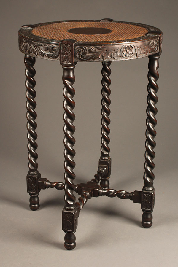 Antique English side table with caned top.