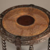 Antique English side table with caned top.