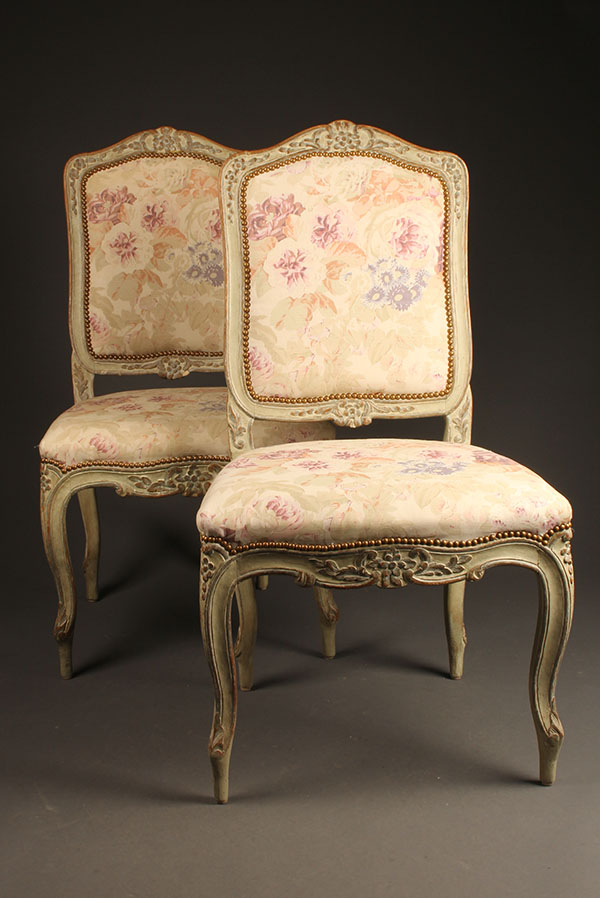 Antique pair of French Louis XV style side chairs.