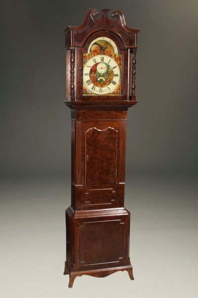 Mid 19th century English tall case clock with plum pudding mahogany case, circa 1860.