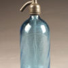 Blue seltzer water bottle from France with etched design and writing, circa 1920's.