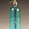 Blue seltzer water bottle from France with raised letters dated 1933.