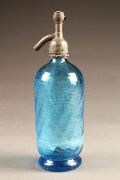 Blue seltzer water bottle from France with etched design, circa 1930's.