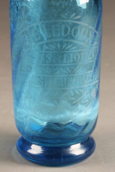 Blue seltzer water bottle from France with etched design, circa 1930's.