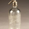 Clear seltzer water bottle from France dated 1937.