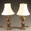 Nice pair of brass urn shaped lamps with silk shades.