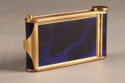 Beautiful ladies compact with lipstick applicator, cigarette case and music box playing the Blue Danube.