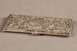 Late 19th century silver repoussé Rococco style stamp case, circa 1860-80.