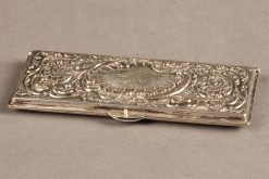 Late 19th century silver repoussé Rococco style stamp case, circa 1860-80.