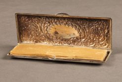 Late 19th century silver repoussé Rococco style stamp case, circa 1860-80.