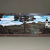 Late 19th century stained and leaded glass panel depicting a castle and trees, circa 1890.