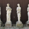 Set of English cast limestone statues representing the four seasons.