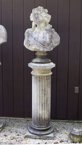 English cast limestone bust of a Bacchante atop a column.