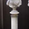 English cast limestone bust of Bacchus atop a classically styled column