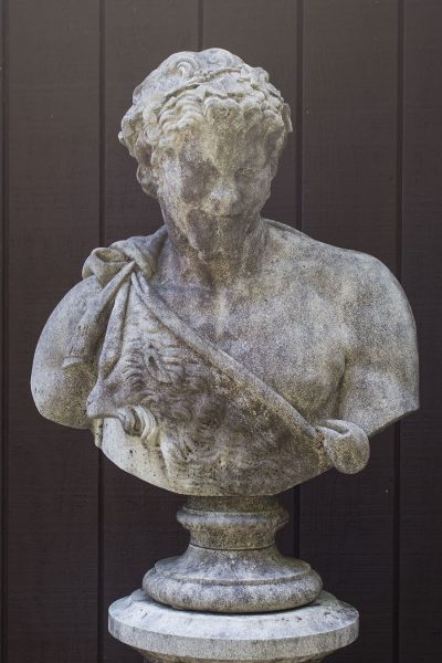 English cast limestone bust of Bacchus atop a classically styled column
