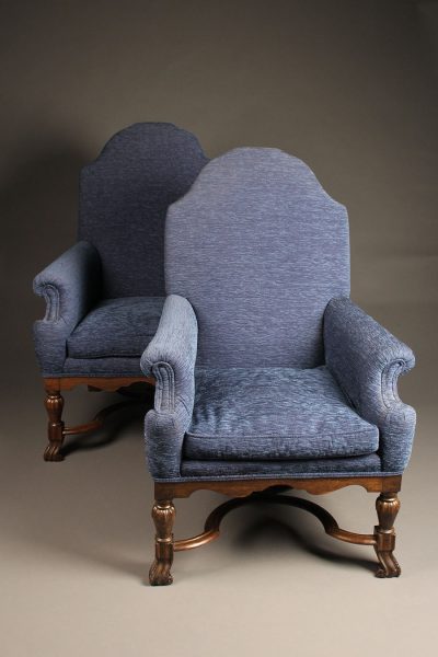 Pair of mid 19th century English arch back armchairs with nicely carved stretcher, circa 1850.