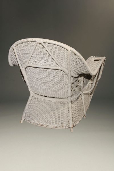 Wonderful pair of wicker armchairs with six legs. These chairs came from the Grand Hotel on Mackinac Island, circa 1900.