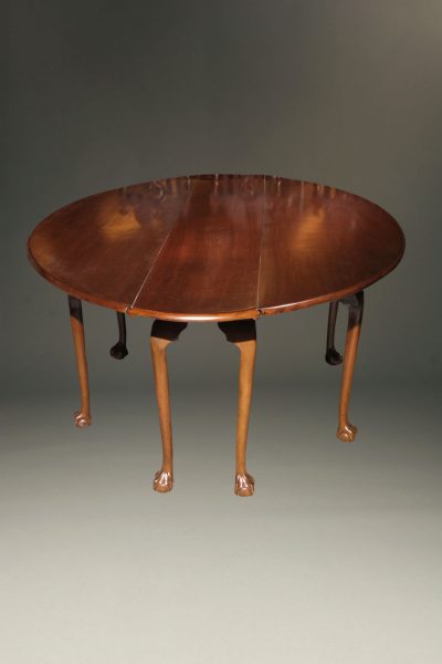 Mahogany Irish wake table with double drop leaves and gatelegs with hand carved ball and claw feet.