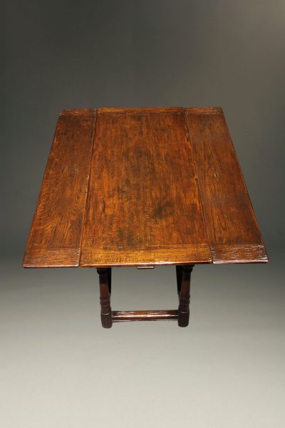 Custom English Jacobean style side draw leaf table in oak.