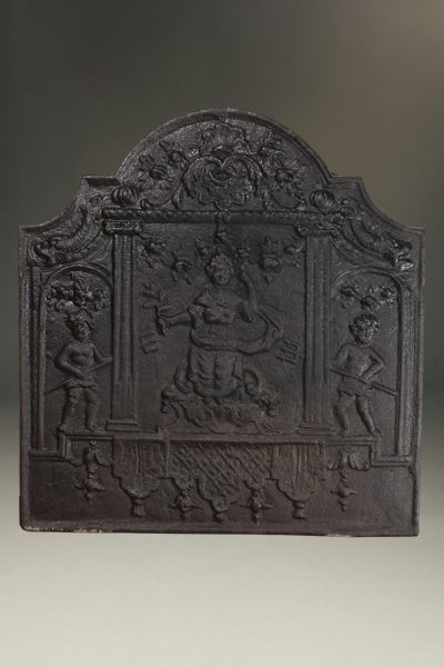 Late 17th century French fireback with a woman and two pitch fork wielding cupids, circa 1680.