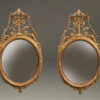 Beautiful pair of oval, Adams style English mirrors with very nice gilded hand carvings, circa 1920's.