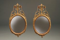 Beautiful pair of oval, Adams style English mirrors with very nice gilded hand carvings, circa 1920's.