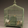 Late 19th century French green wire finch cage with milk glass feeder and bowl