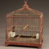 Very nice French finch cage with red painted frame and milk glass water and feeding bowls