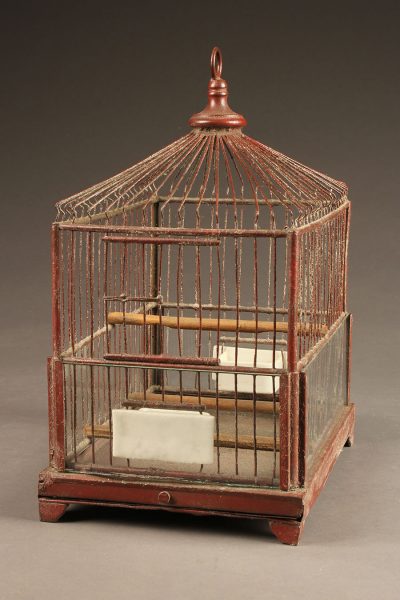 Very nice French finch cage with red painted frame and milk glass water and feeding bowls