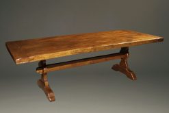Custom English oak farmhouse table with wood pegged mortise and tenon joinery and hand hewn top.