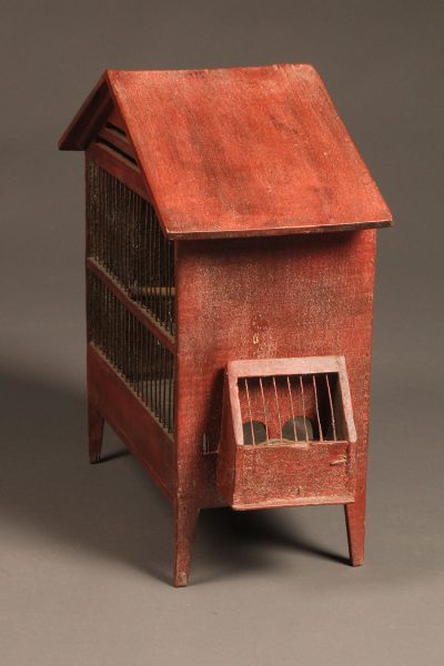 Late 19th century French finch cage with red paint and hand blown glass water bottle